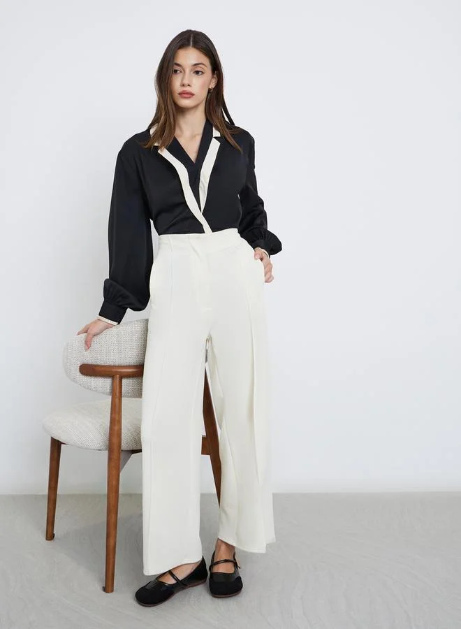 ستايلي بلوزة بأكمام بالون بنمط لف