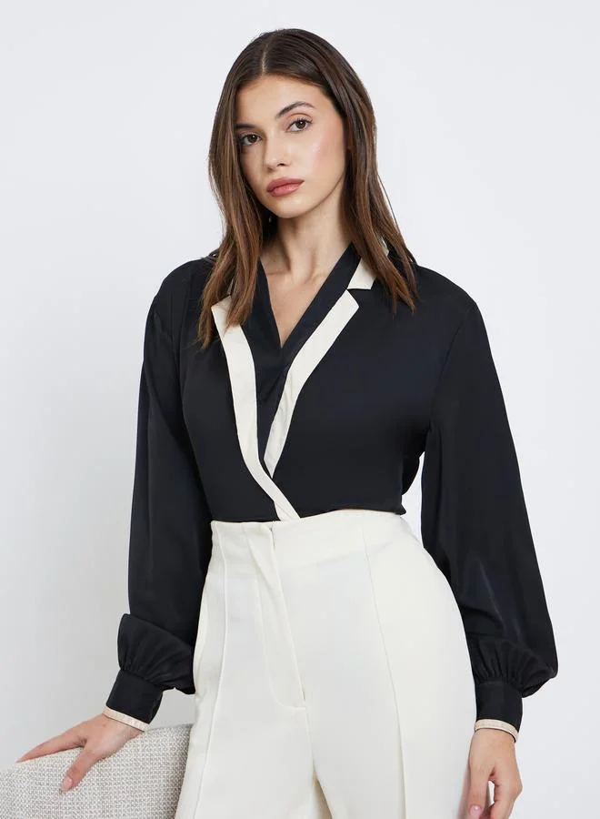 ستايلي بلوزة بأكمام بالون بنمط لف