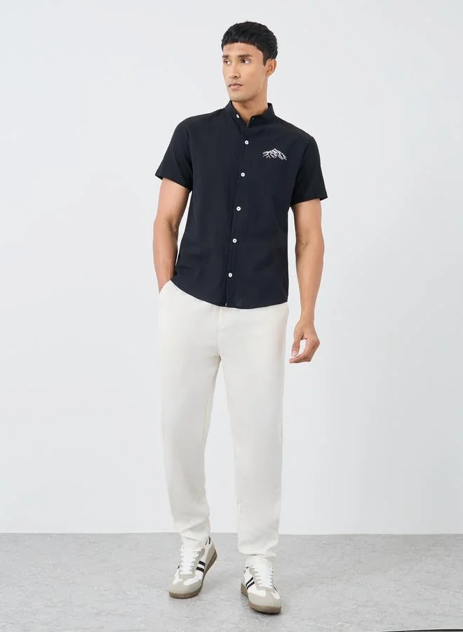 تايك تو قميص بأزرار بأكمام قصيرة وطبعة جرافيك