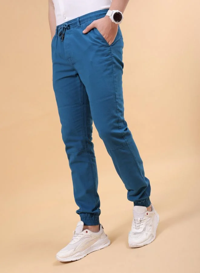 شركة المرآب الهندية Men Slim Fit Solid Mid-Rise Elasticated Linen Jogger Trouser