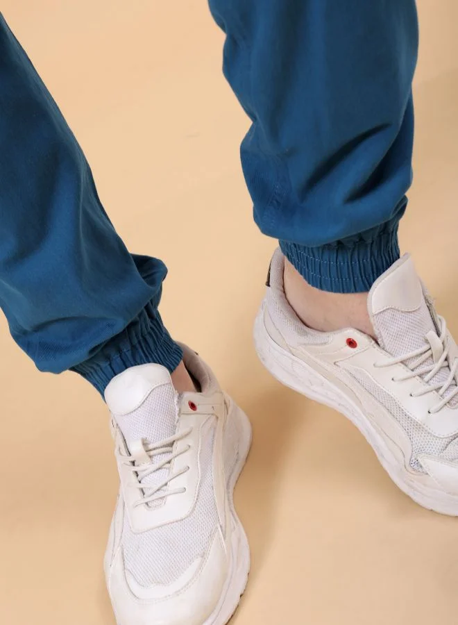 شركة المرآب الهندية Men Slim Fit Solid Mid-Rise Elasticated Linen Jogger Trouser