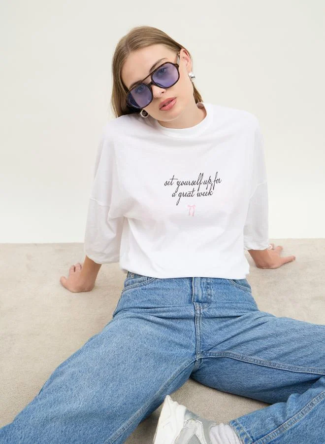 Styli Women White Slogan Print Exaggerated Shoulder Oversized T-Shirt