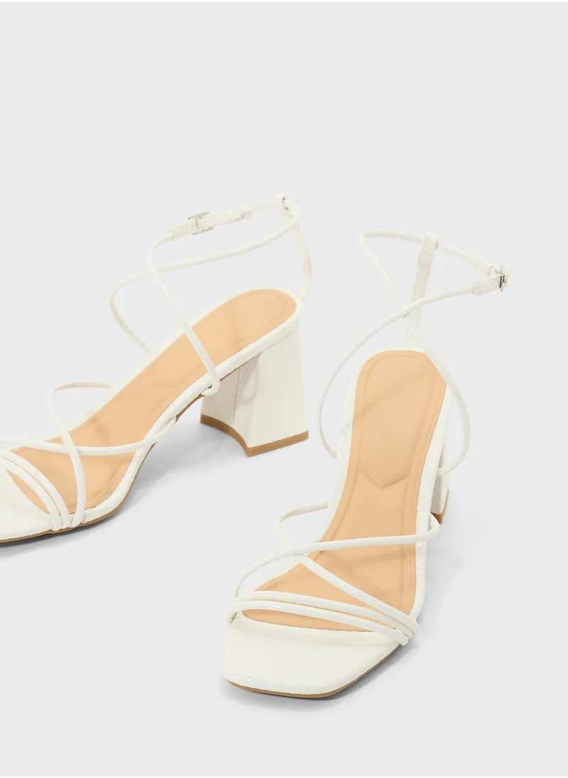 ترافل من نمشي Flaire Block Heel Multi Strap Ankle Strap Block Heel Sandal