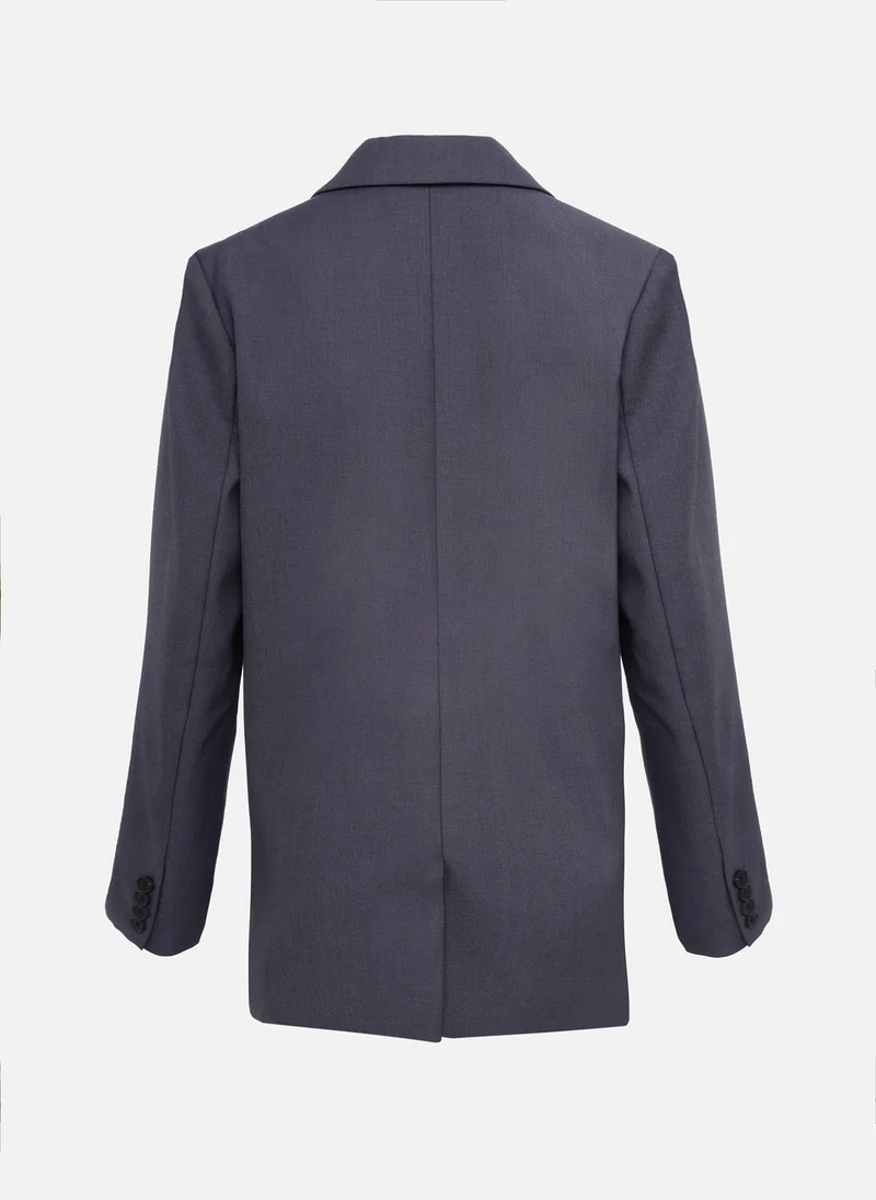 ليتشي سترة أحادية الصدر بأزرار متباينة