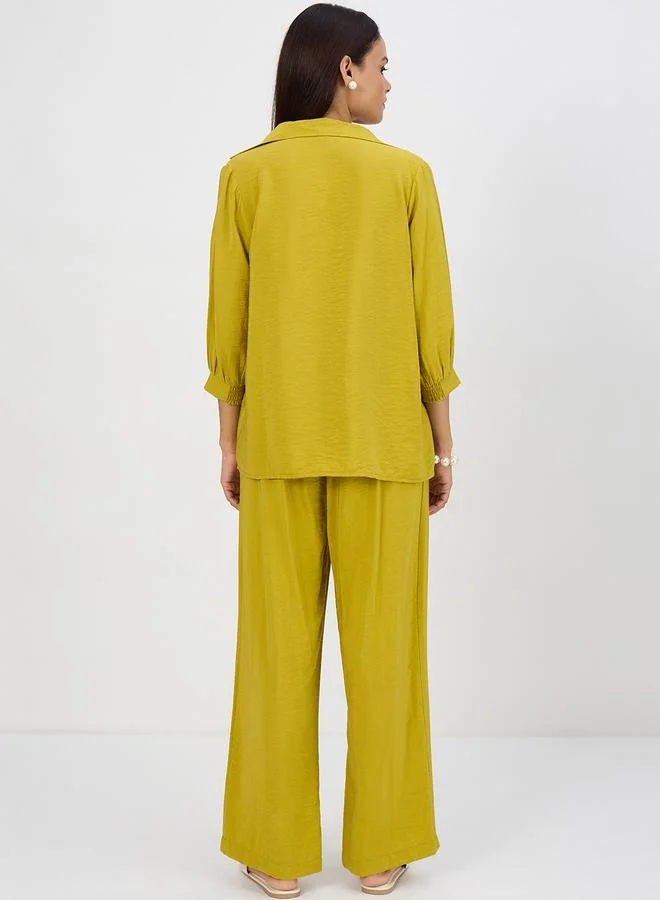 فيميلا طقم بلوزة بتفاصيل كسرات وبنطال