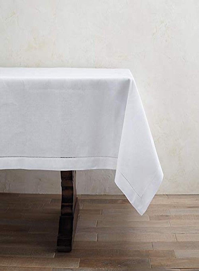 Fennco Styles Classic Solid Color Hemstitched Border Tablecloth for Dining Table, Banquet, Wedding, Family Dinne 70 x104 Inch, White - Image 2