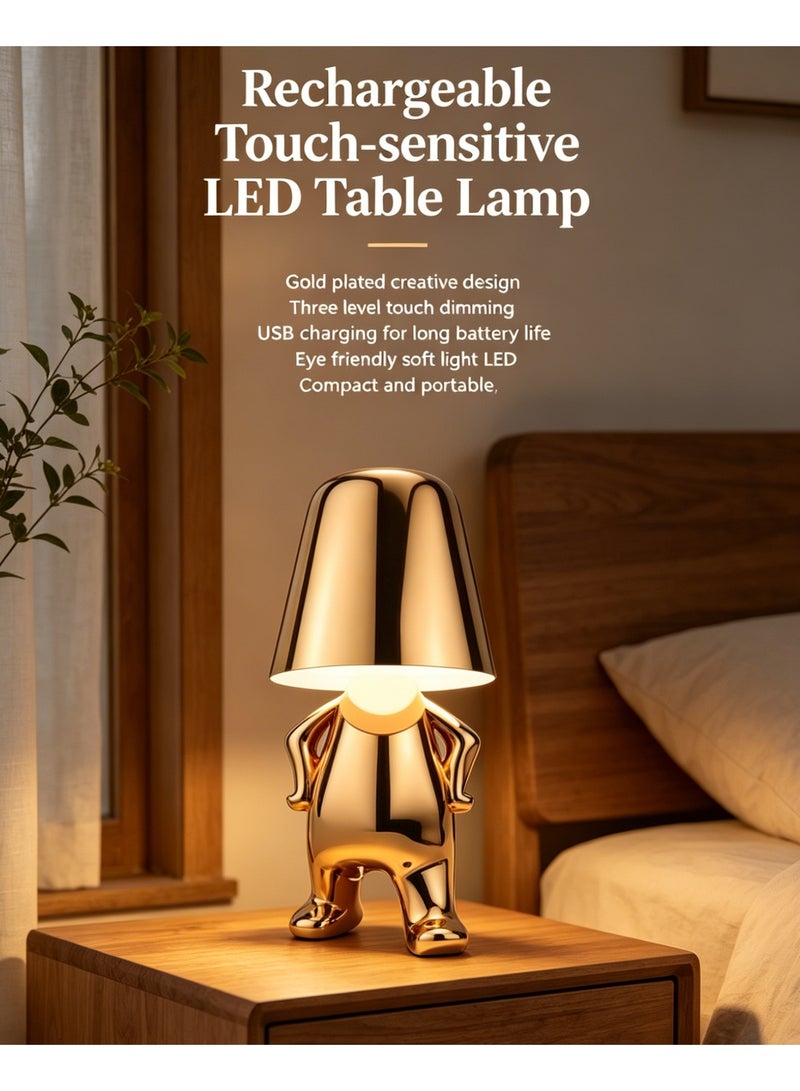 Rich Life Rechargeable touch-sensitive LED table lamp, featuring a creative golden figurine with arms akimbo, USB fast charging for extended battery life, and three adjustable color temperature levels. It serves both as a decorative element and a lighting source, ideal for bedside tables in bedrooms and desktops in offices. With its light luxury feel, it makes a great gift for festivals - Image 1