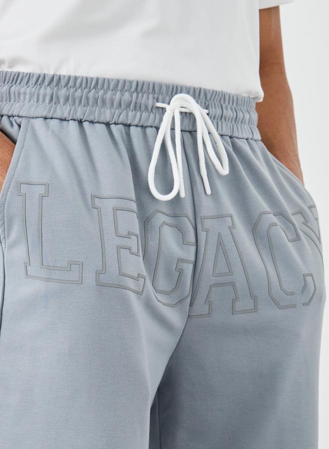 ستايلي بنطلون رياضي ستایلی رجالي رمادي بشعار ليجاسي مع رباط - Image 3