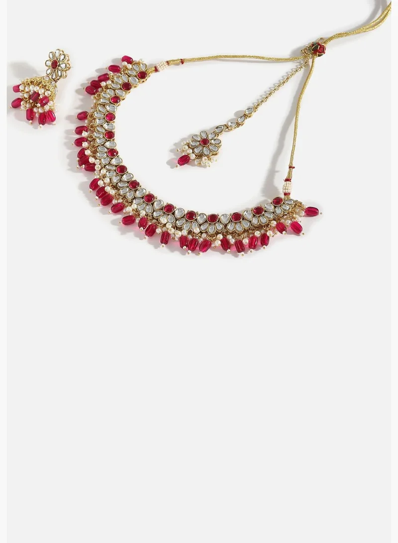 SOHI Gold Plated Designer Stone Party Necklace, Earring and Maang Tikka Set For Women