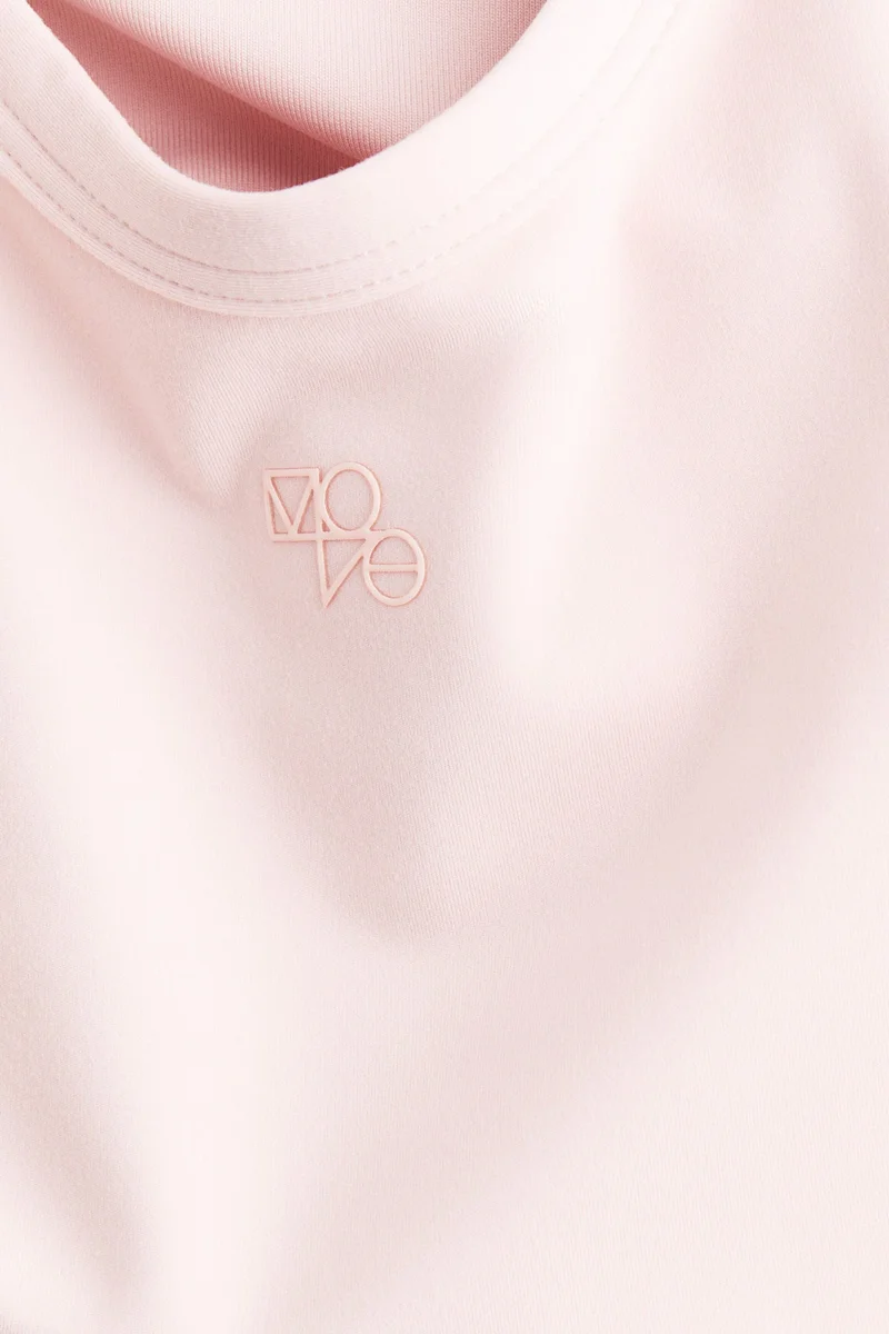 H&M Integral-bra sports strappy top with SoftMove™