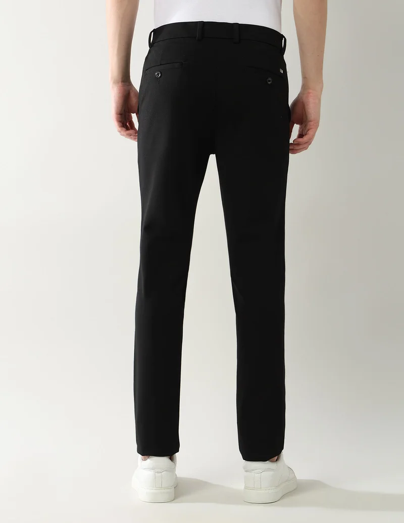 Arrow Black Slim Fit Knitted Autoflex Trousers for Men | Best Price UAE