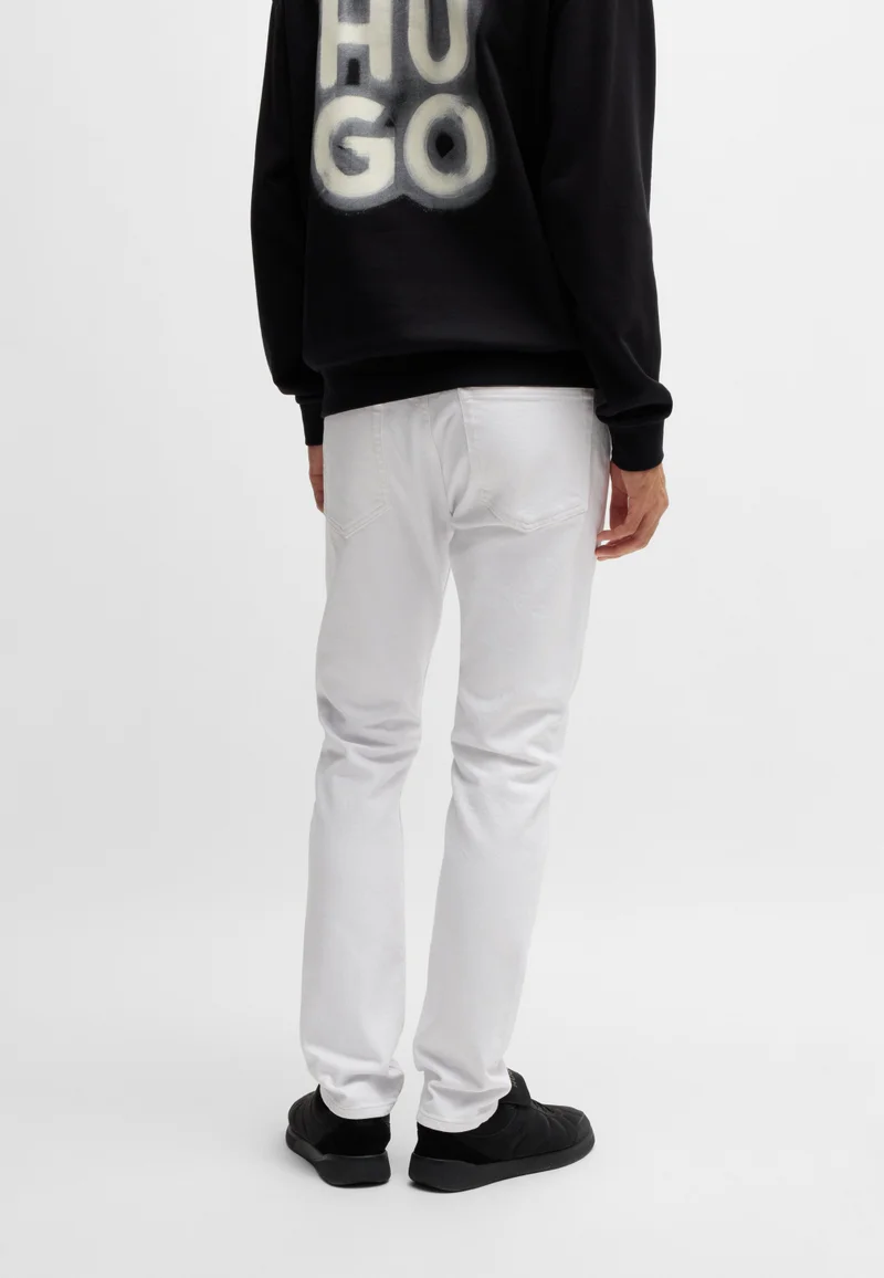 هوجو جينز أبيض بقصة ضيقة من قماش دينم مطاطي