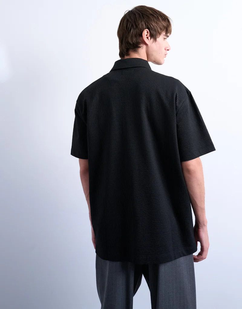 توب مان قميص بسحاب كبير من قماش السيرساكر