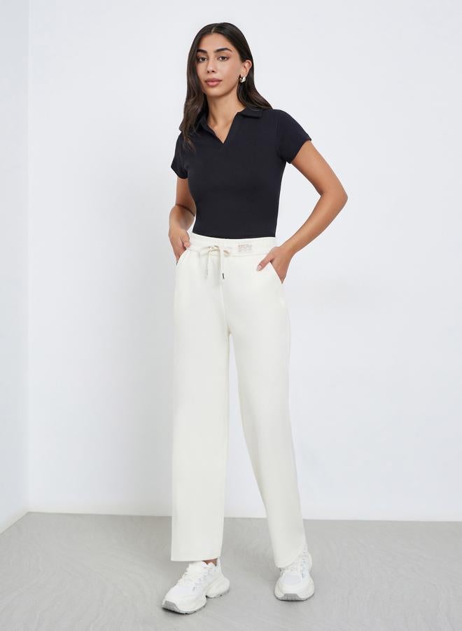 Styli Beige Solid Wide Leg Pants with Drawstring - Image 1