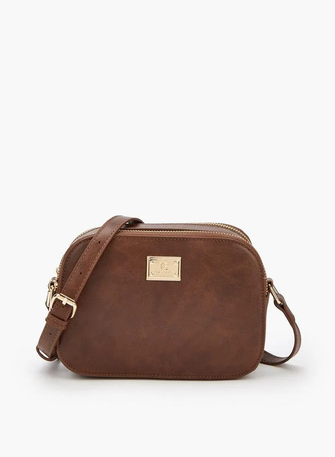 فلورا بيلا من شو إكسبرس حقيبة كروس بودي بشعار مميز وحزام كتف قابل للتعديل