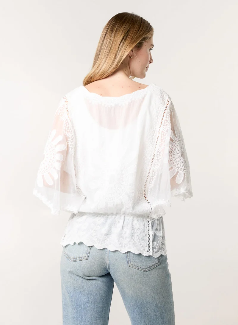 بلو فانيلا بلوزة بأكمام دانتيل على شكل زهرة الشمس