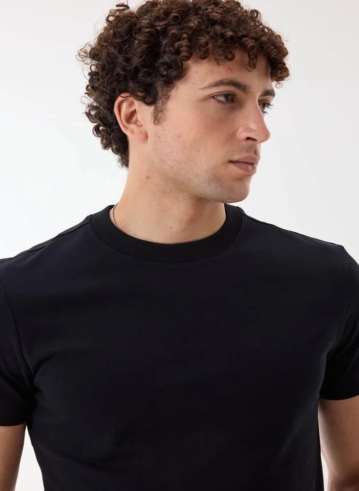 Ashita Fernandes  Jorvean Men’s Black Cotton Blend T-Shirt – Relaxed Fit, Solid, Lightweight Casual Wear for Men | Best Price UAE