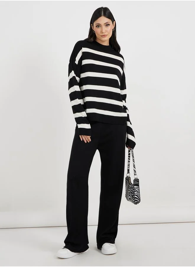 ستايلي Oversized Striped Sweater and Wide Leg Pants Co-Ords