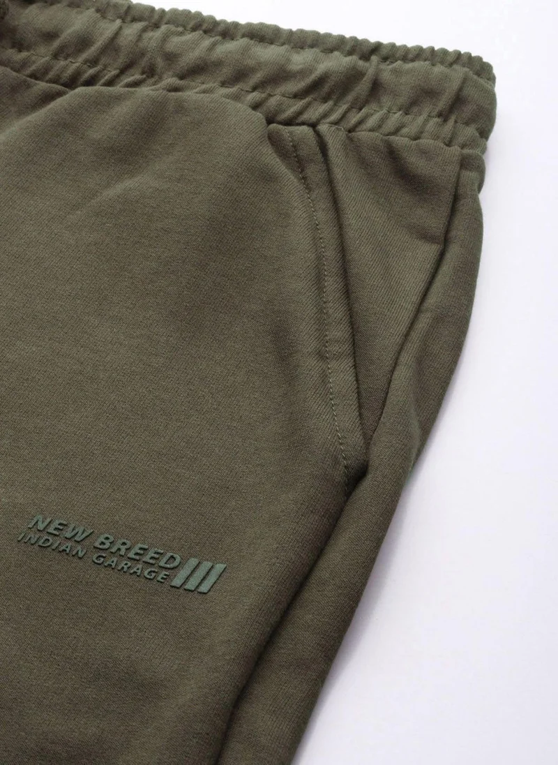 The Indian Garage Co Men Slim Fit Solid Mid-Rise Stretchable Knitted Jogger Trousers