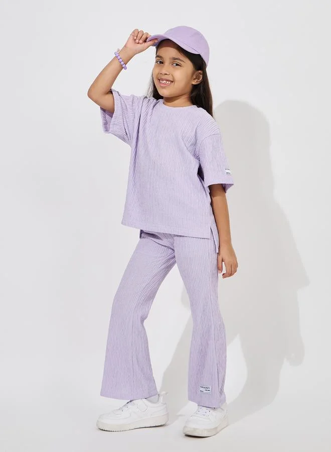 Styli Drop Shoulder Textured T-Shirt & Flared Pants Set