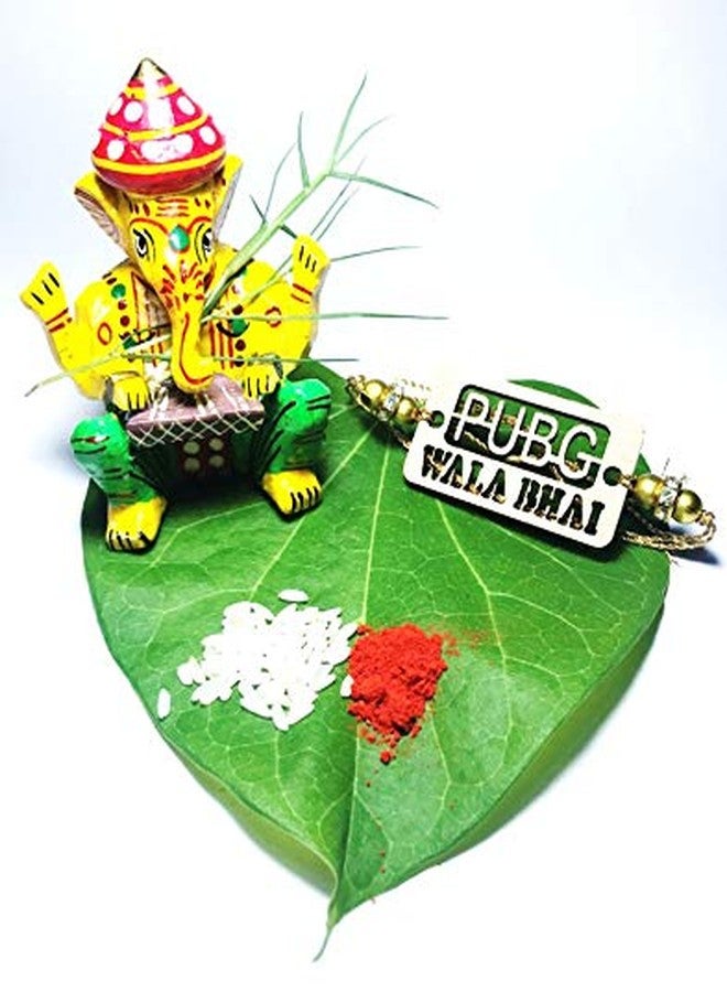 Hand Crafted Beautiful Designer Rakhi & wooden Ganpati with Pack of Roli & Chawal