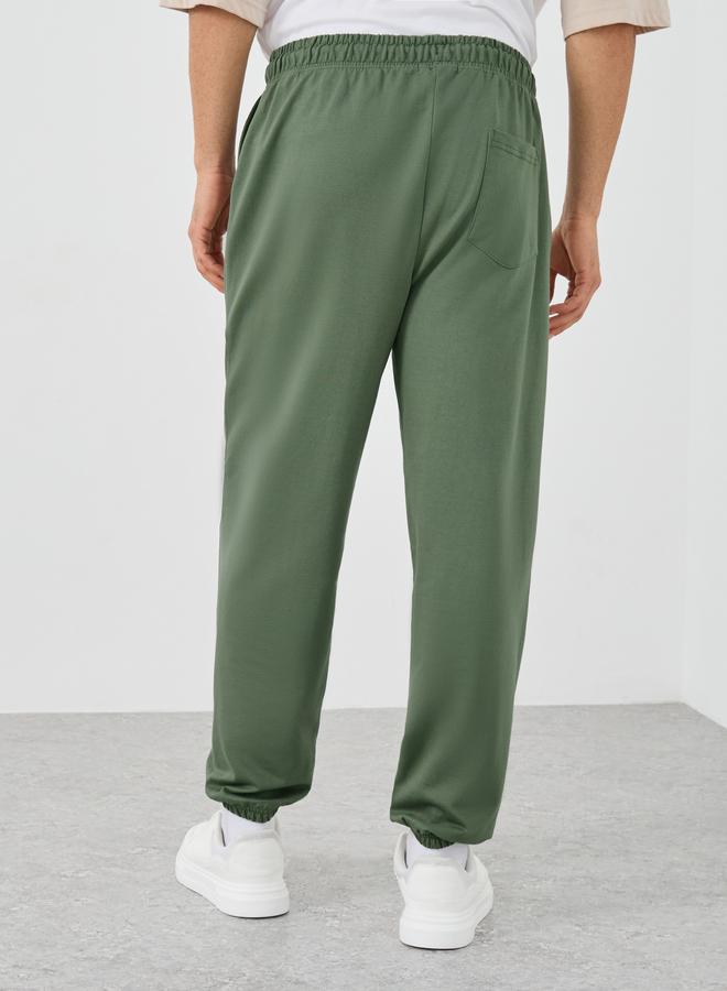 Styli Styli Textured Slogan Print Oversized Joggers  - Image 4