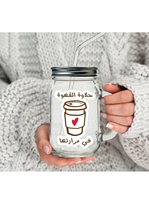 A jar for coffee juice and water with a sweet and bitter coffee print with a metal lid and a multicolored straw