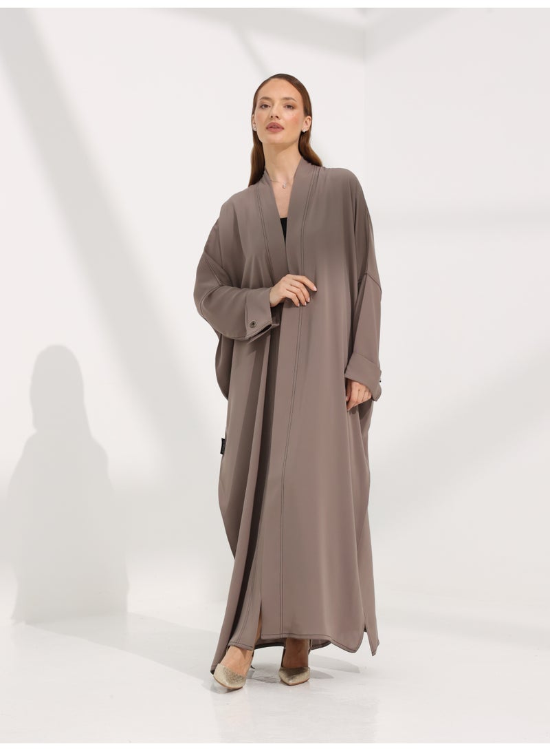 Khan&Co. Seven Seas Mocha Abaya in an earthy crepe fabric colour with two gold KHAN&CO logo buttons - by Abdullah Khan - Image 1