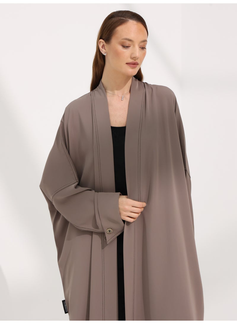Khan&Co. Seven Seas Mocha Abaya in an earthy crepe fabric colour with two gold KHAN&CO logo buttons - by Abdullah Khan - Image 2