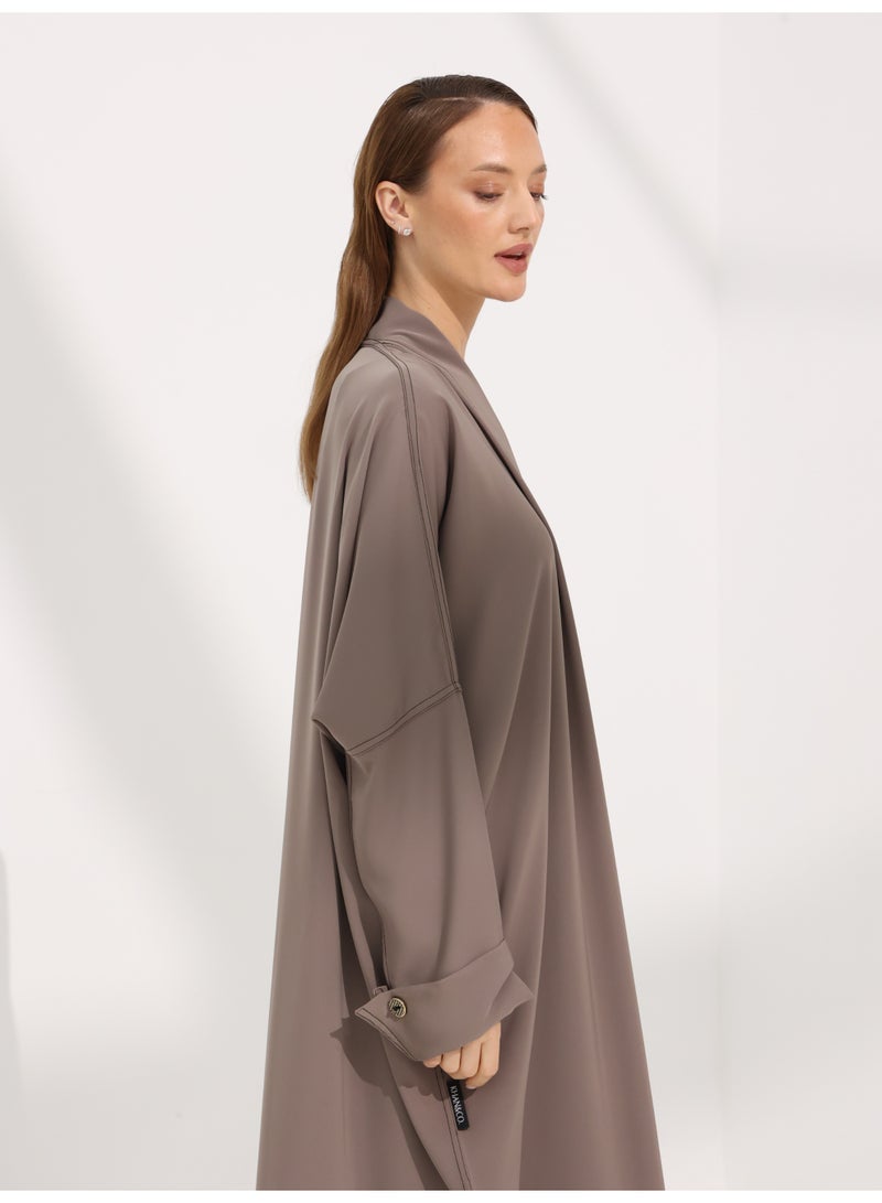 Khan&Co. Seven Seas Mocha Abaya in an earthy crepe fabric colour with two gold KHAN&CO logo buttons - by Abdullah Khan - Image 4