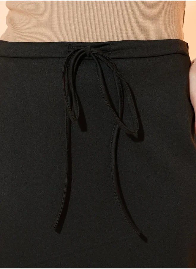 Styli Solid Back Slit Midi Skirt with Drawstring