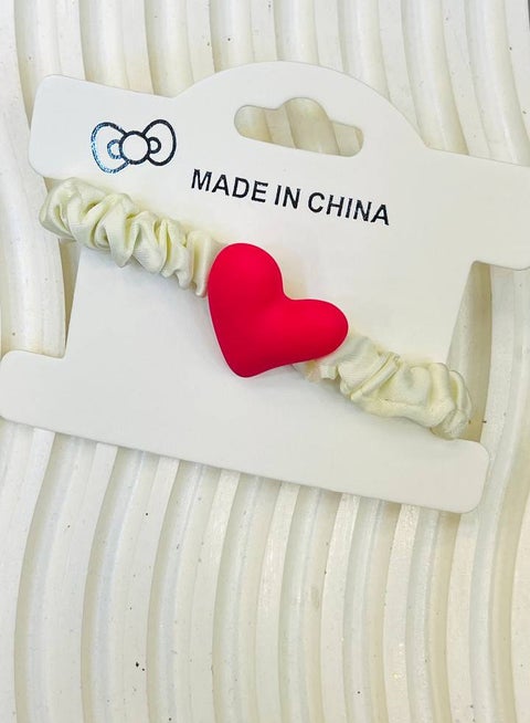 Hair elastic for kids with an elegant heart design in the center — A delicate touch for your little one's beauty!