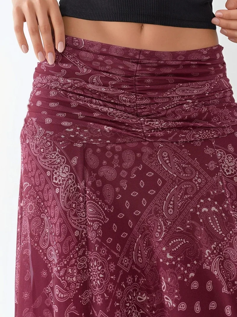 زوبعة تنورة ميدي ملفوفة بنقوش وتفاصيل بكشكش