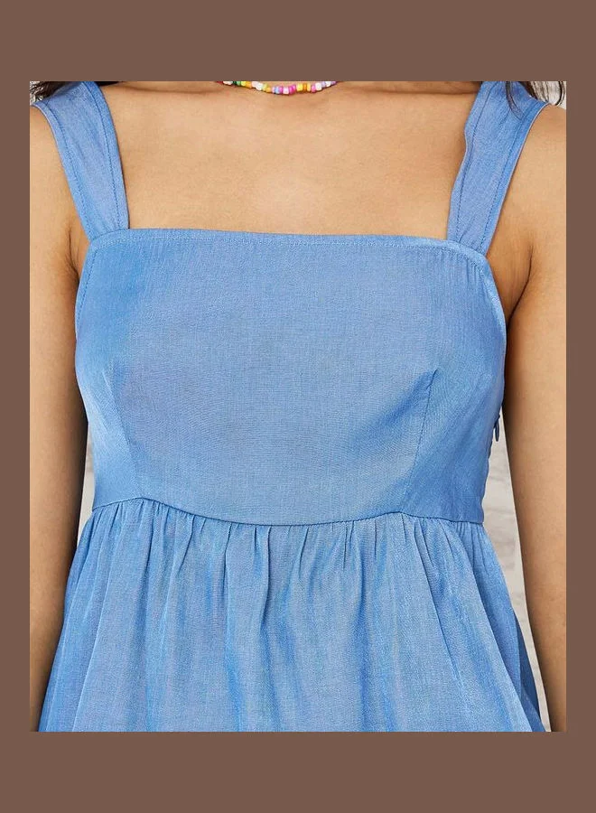 Styli Sleeveless Denim Peplum Top with Tie Back Detail