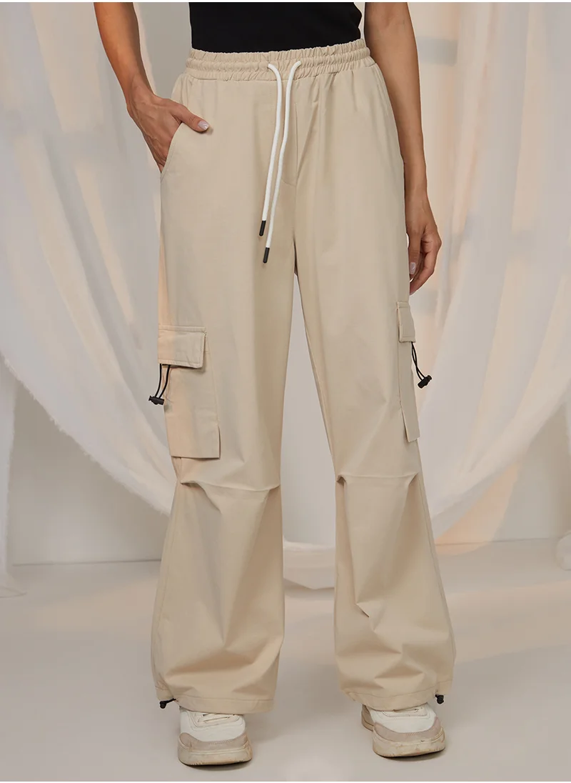 PINACOLADA Women's Beige Solid Cargo Parachute Trousers