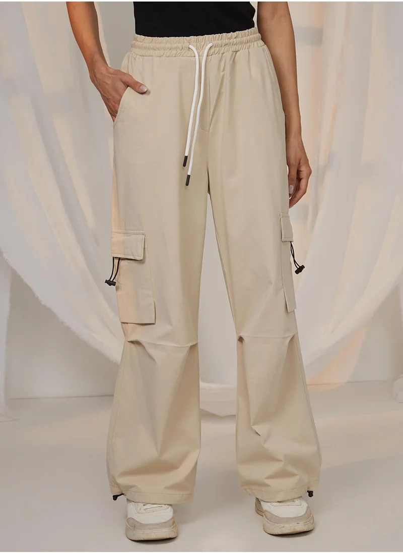PINACOLADA Women's Beige Solid Cargo Parachute Trousers