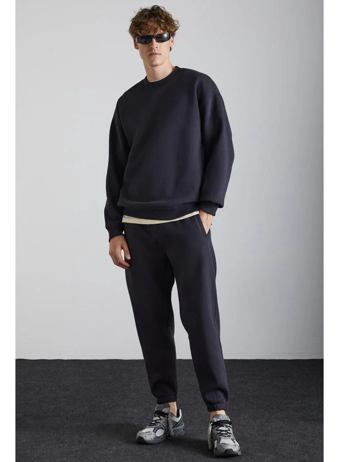 Grimelange Kyoto Men's Organic Cotton Lined Polarity Wide-Cut Elastic Jogger Anthracite Sweatpants.