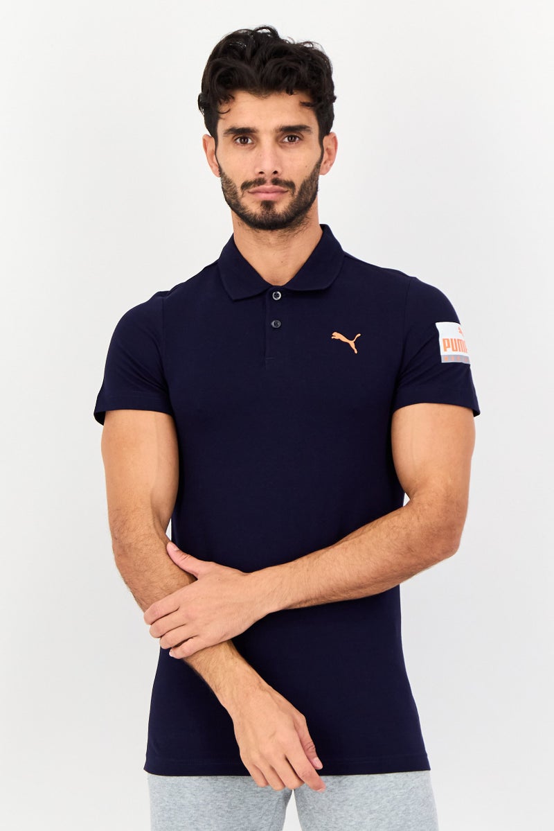 PUMA قميص بولو خارجي للرجال بقصة ضيقة بأكمام قصيرة، كحلي داكن - Image 1