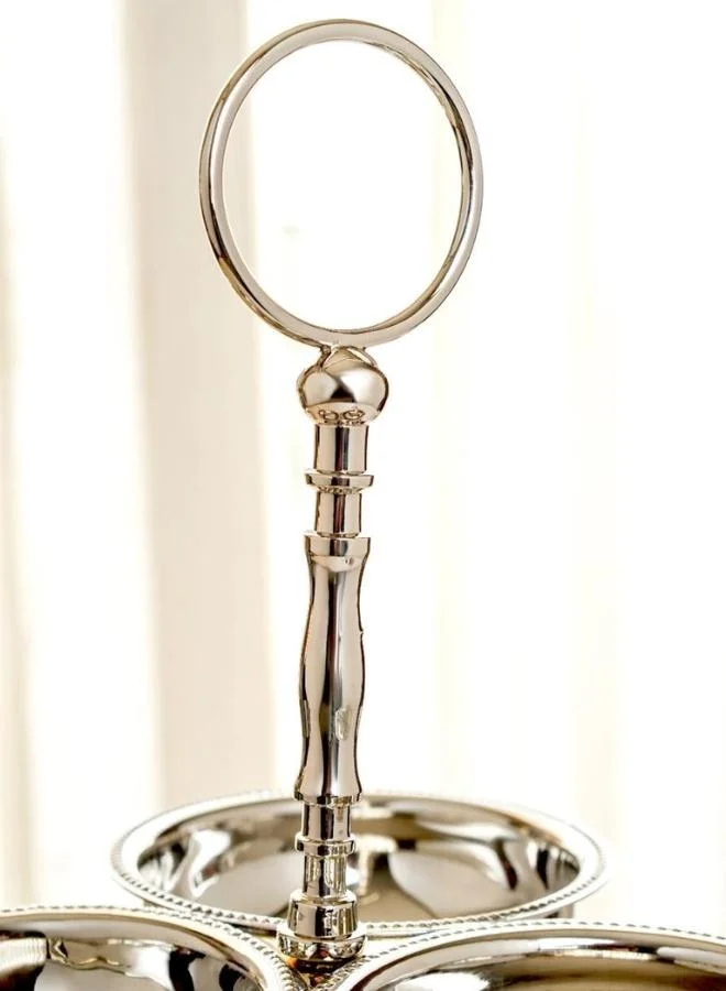 Casa Quesera Elevate your hosting experience with Zarif, a handmade silver-plated 2-tier serving stand crafted on a durable brass base. Featuring three integrated bowls and one central plate, this elegant piece is perfect for serving dry fruits, sweets, snacks, or as a stunning decorative centerpiece. Its intricate design, fine craftsmanship, and timeless shine make it an ideal choice for festive occasions, weddings, or luxury home décor.