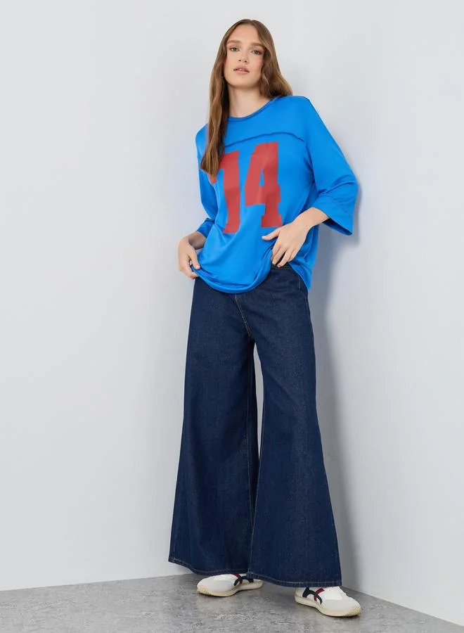 تايك تو تيشيرت واسع بطبعة غرافيك