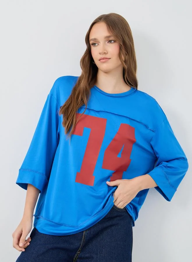 تايك تو تيشيرت واسع بطبعة غرافيك