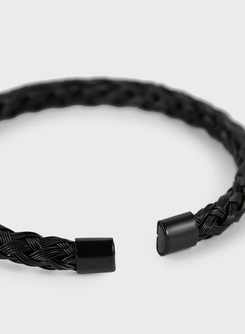 Seventy Five Metal Plait Bangle Bracelet