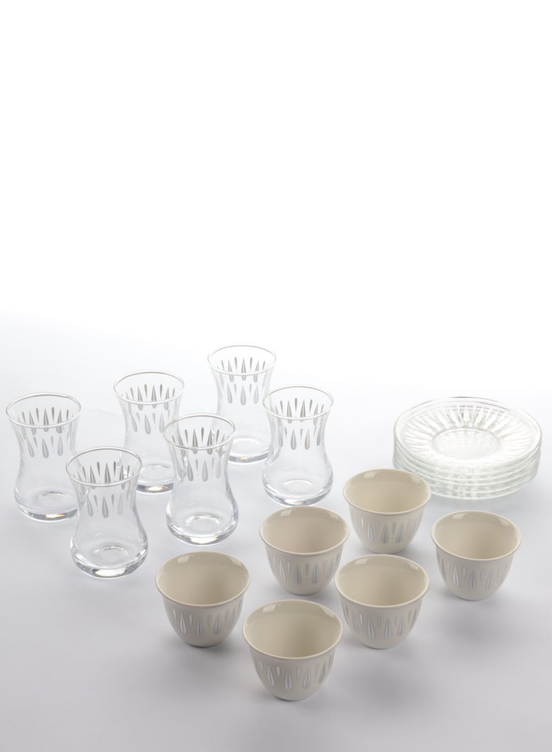 A set of glass and ceramic tea cups and coffee cups with elegant, modern designs in silver - a touch of luxury and good taste.