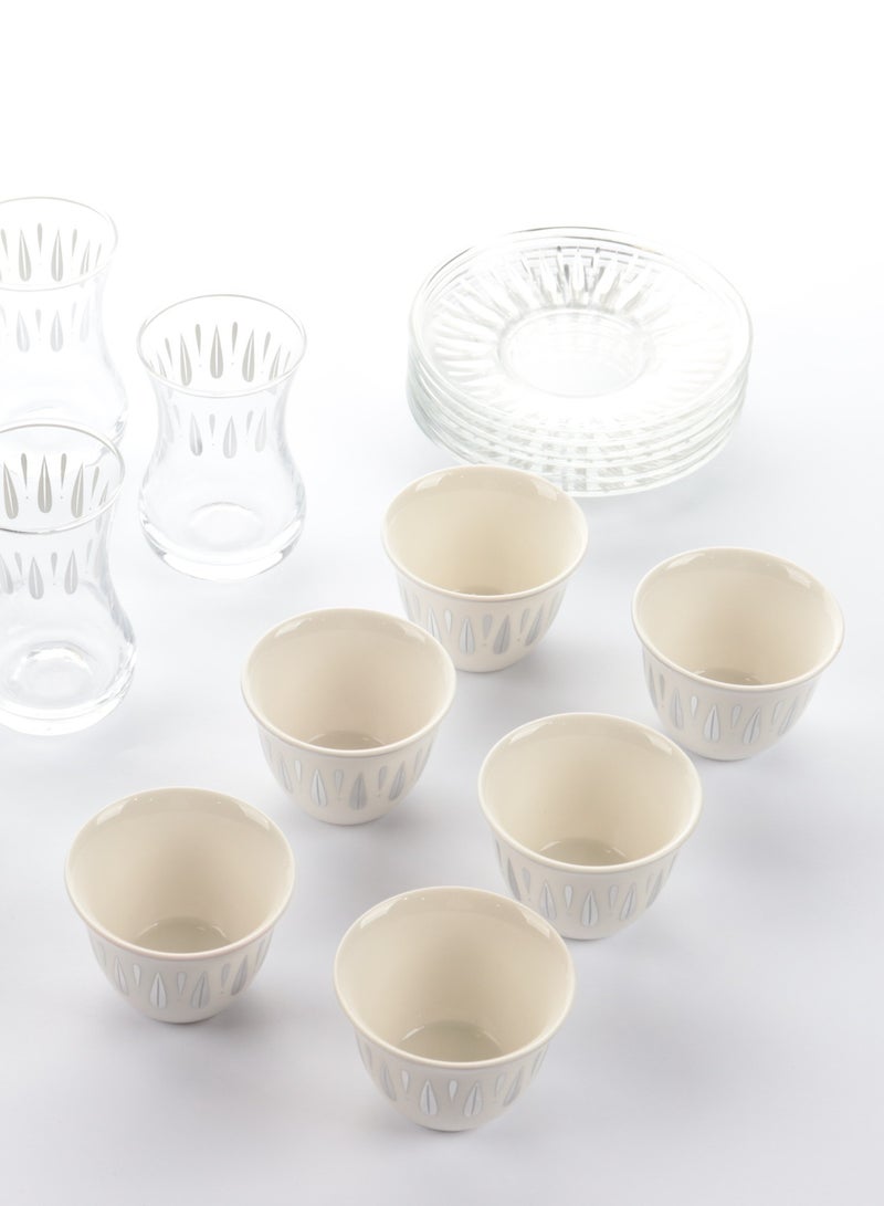 A set of glass and ceramic tea cups and coffee cups with elegant, modern designs in silver - a touch of luxury and good taste.