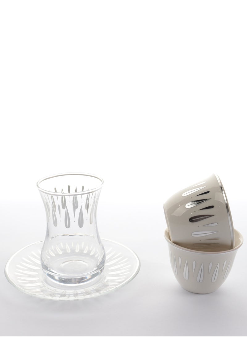 A set of glass and ceramic tea cups and coffee cups with elegant, modern designs in silver - a touch of luxury and good taste.