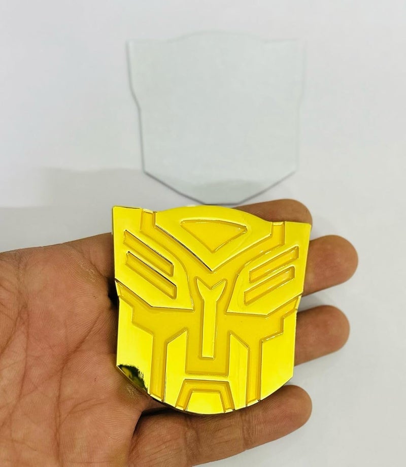 AUTO MT Emblems for Car & Bike Metal Lo.go and Grill Me.tal Lo.go, Auto Accessories for Car Emblem 3D Badge Auto Racing Sport Sticker Grand Tourer Decal. (Small Golden TRANSFORMERR Logo) - Image 1