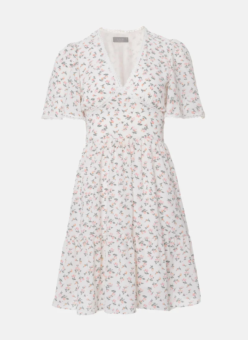 Lichi Mini dress trimmed with broderie anglaise