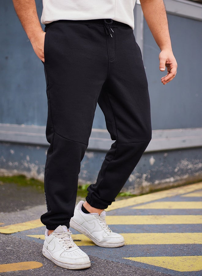 Black Regular Cut Text Print Detailed Sweatpants TMNAW25EA00003