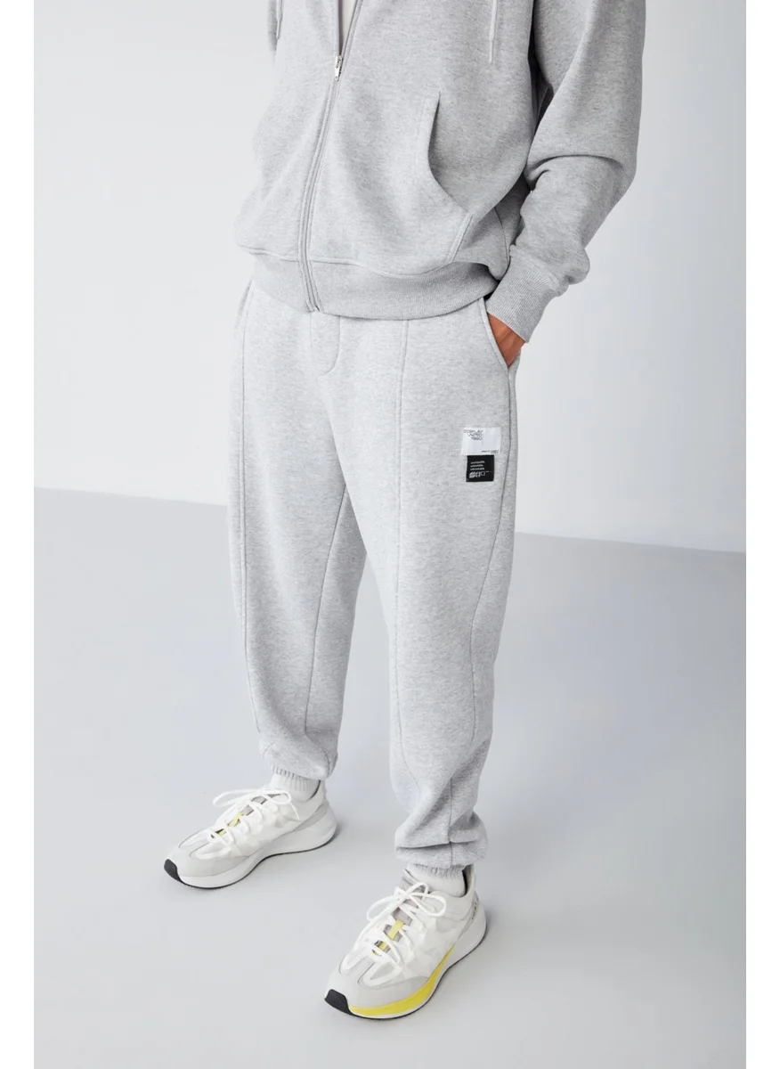 GRIMELANGE Rowan Men's Relaxed, Ribbed Front, Decorative Labeled, Grey Melanj Sweatpants