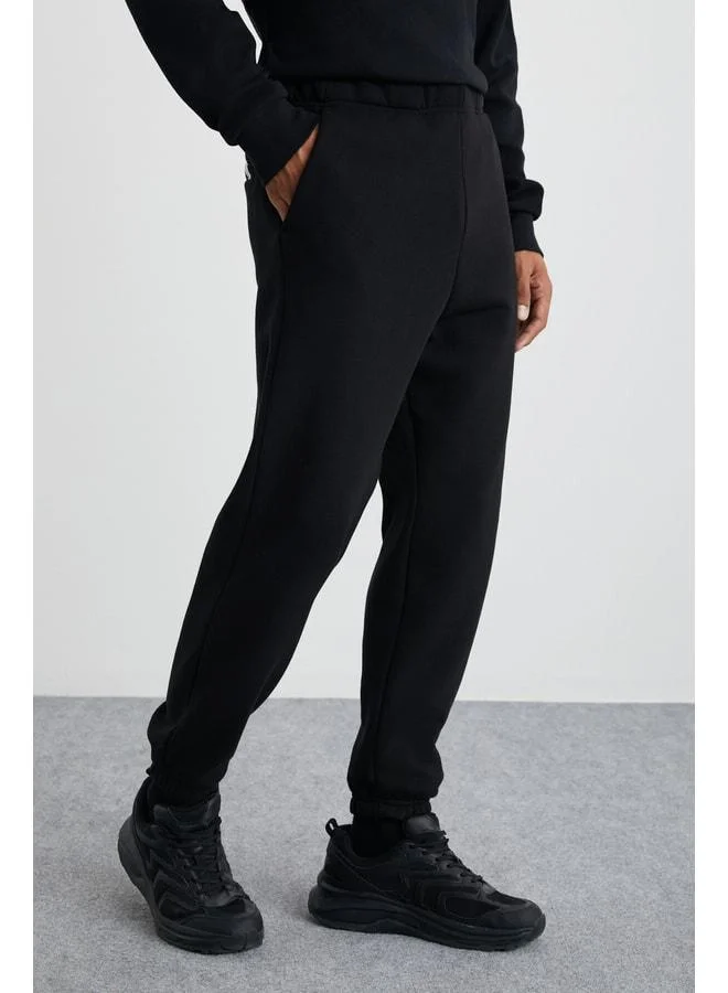 GRIMELANGE Burnham Men's Organic Fabric Lined with Polar Fleece Relaxed Fit Elastic Jogger Black Sweatpants.